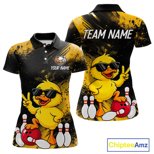 Front and back views of a custom short-sleeve polo shirt featuring a cartoon yellow duck wearing black sunglasses, bowling with red bowling balls and white bowling pins, on a black and yellow splatter background. The front shows 'YOUR NAME' and a crest placeholder, and the back shows 'TEAM NAME'.