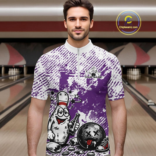 Male model in a bowling lane wearing a purple and white quarter-zip shirt, humorous drunk bowling pin illustration with beer bottle and ball.