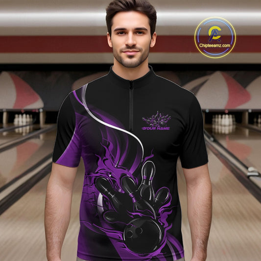 Male model front view inside bowling venue wearing black and purple quarter zip shirt featuring flame bowling action illustration