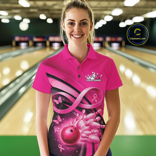 Female model in a bowling lane wearing a pink polo shirt with awareness ribbon accents, butterflies, and bowling graphics.
