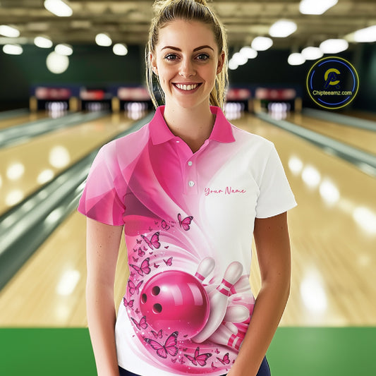 Front view of a female model wearing a white and pink bowling polo shirt with butterfly accents and bowling-themed graphics.