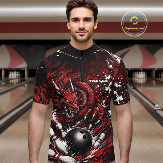 Man wearing a red and black dragon-themed bowling shirt in a bowling alley.