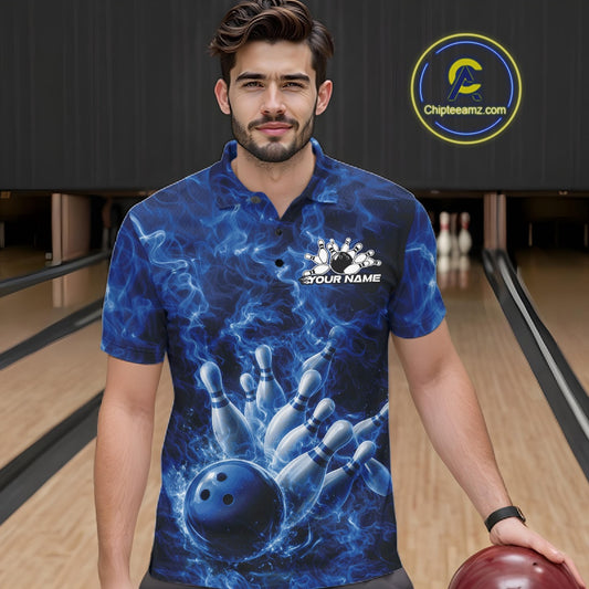Male model at the bowling lane wearing a bowling polo with blue bowling ball artwork and fiery graphics.
