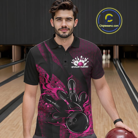 Male model at a bowling lane wearing a black and pink bowling polo shirt with bowling strike artwork, geometric accents, and diagonal striping.