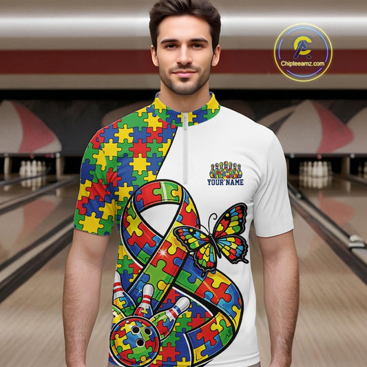 Inside Bowling Center, Front View Male Model Wearing White Quarter-Zip Shirt, Autism Ribbon Puzzle Artwork With Butterfly And Dynamic Bowling Strike Scene
