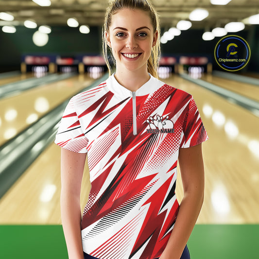 Woman wearing a red and white patterned bowling shirt in a bowling alley.
