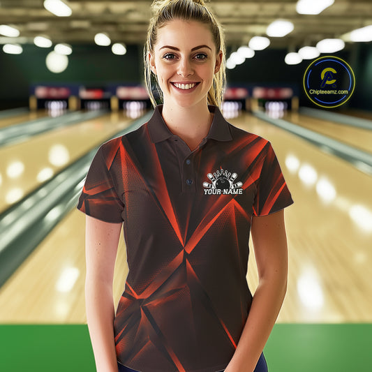 Woman wearing a custom orange bowling shirt with a logo and text in a bowling alley.