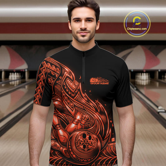 Male model wearing a black and orange bowling quarter-zip shirt at the lane with Polynesian-style tribal flame bowling graphics.