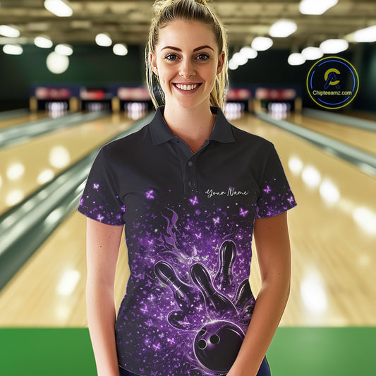 Female model in a black and purple bowling polo shirt at the bowling lane with flames and butterfly accents.