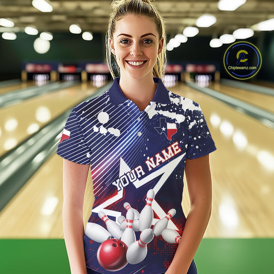 A woman stands in a bowling alley wearing a custom printed bowling-themed polo shirt. The shirt features a navy blue base with white and red graphics, including bowling pins, a red bowling ball, and the text 'YOUR NAME'.