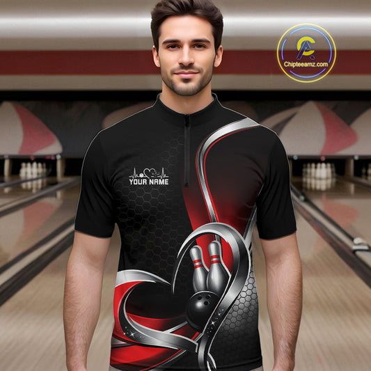 Male model in a bowling lane wearing a black and red quarter zip shirt with honeycomb design and a heart-framed bowling strike graphic.