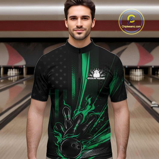 Male model wearing a black and green bowling quarter-zip shirt at a bowling lane with patriotic bowling strike artwork and distressed flag graphics.