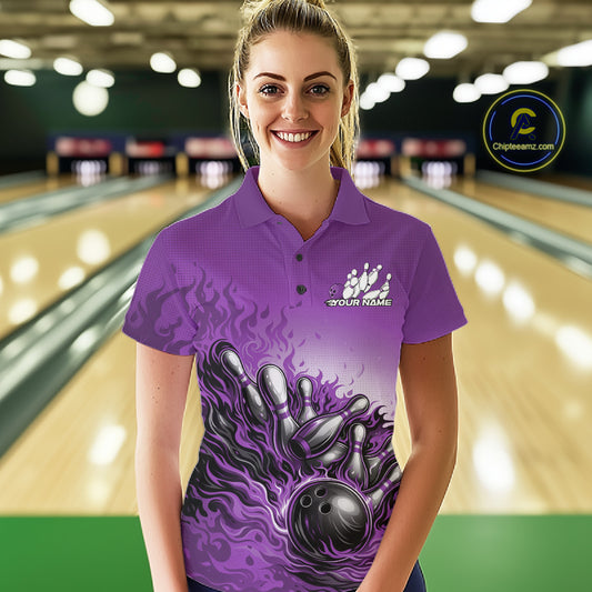 Female Model At Bowling Lane Front View Wearing Purple Polo Shirt With Flaming Bowling Ball Hitting Pins And Dynamic Motion Artwork