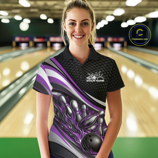 Female model in a bowling lane wearing a black and purple polo shirt, fiery bowling ball striking pins with energetic sports graphics.