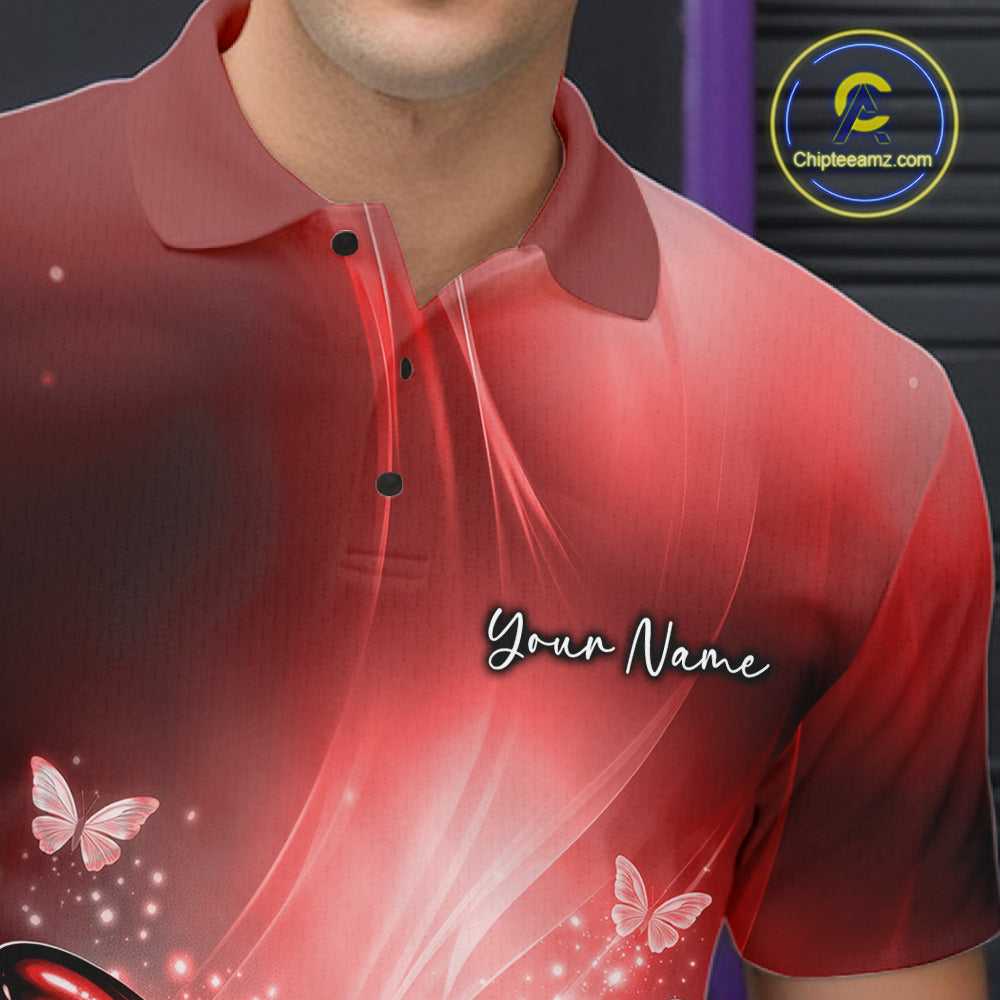 Close-up of the left chest area on a red bowling polo shirt showcasing a butterfly beside a bowling ball and scattered pins.