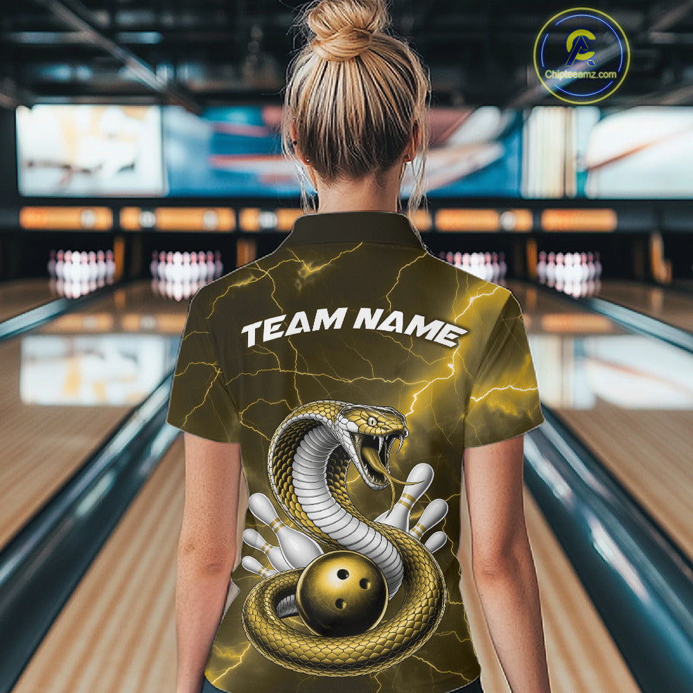Back view of a womens bowling polo displaying a yellow cobra wrapped around a bowling ball with scattered pins.