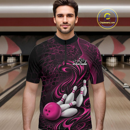 Male model standing in a bowling lane wearing a black and pink bowling quarter-zip shirt featuring a tribal flame bowling ball and pins graphic on the front.