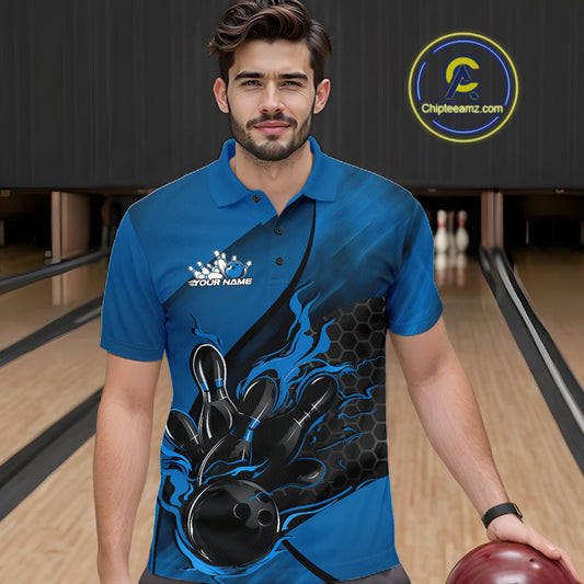 Male model wearing a black and blue bowling polo shirt at a bowling lane with fiery bowling strike artwork and geometric styling.