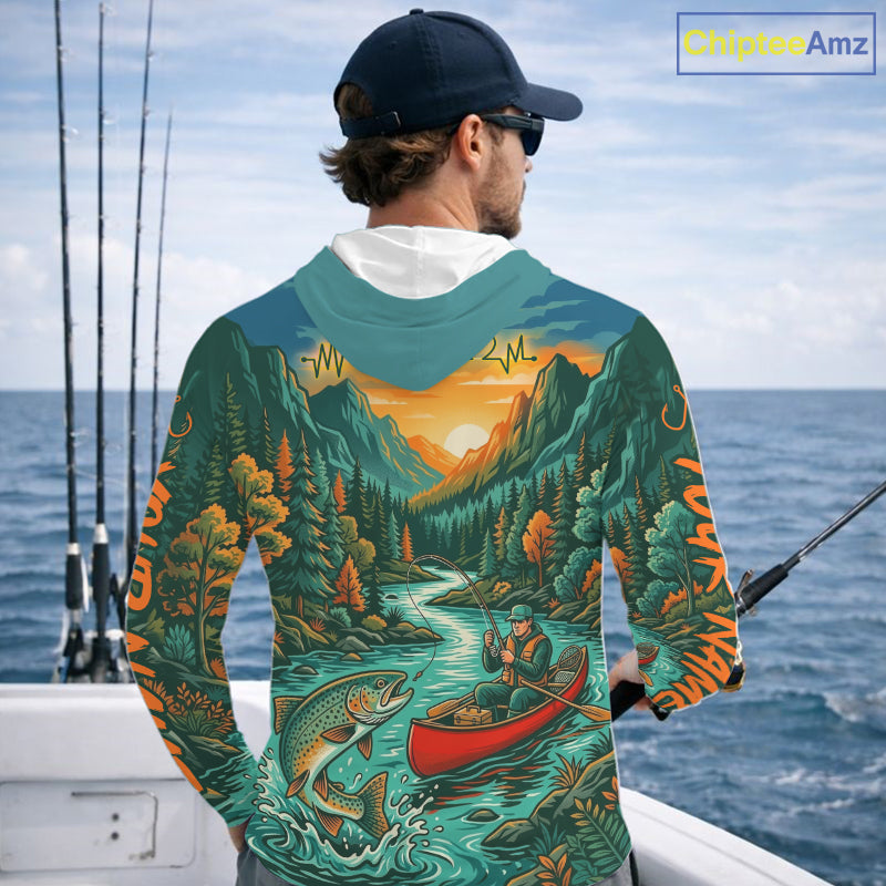 Man wearing a hoodie with a nature-themed design while fishing on a boat.