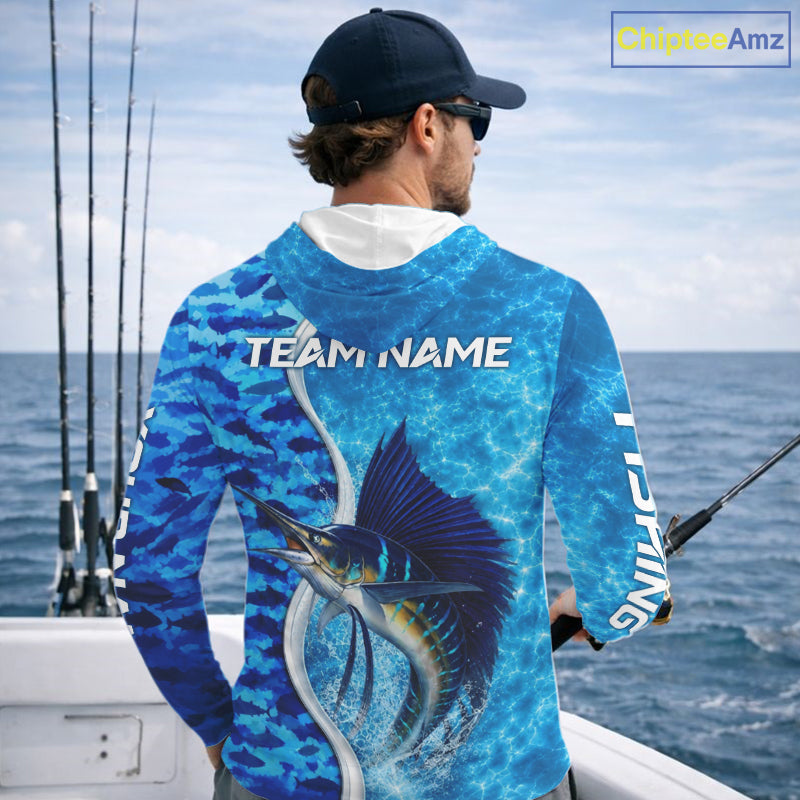 Angler wearing Sailfish fishing blue ocean camouflage performance long sleeve hooded fishing shirt on the water