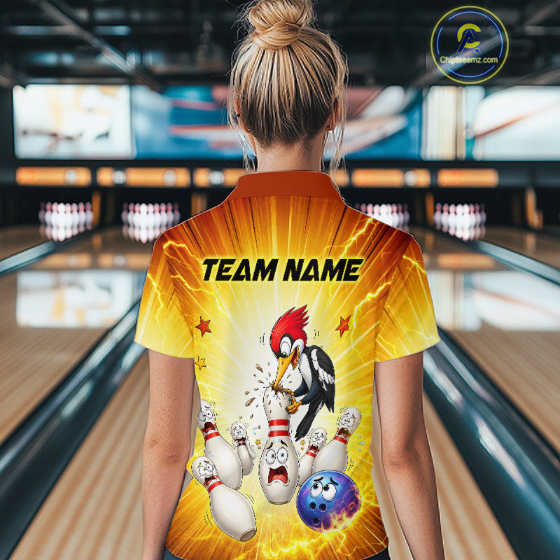 Person wearing a bowling-themed shirt with cartoon characters in a bowling alley.