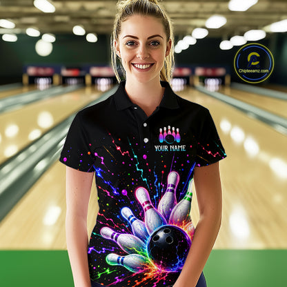 Woman wearing a colorful bowling-themed shirt with a bowling alley in the background