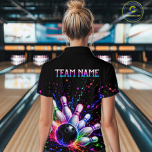 Load image into Gallery viewer, Person wearing a black bowling shirt with colorful design and 'TEAM NAME' text in a bowling alley.