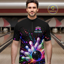 Load image into Gallery viewer, Man wearing a black bowling shirt with colorful design in a bowling alley.