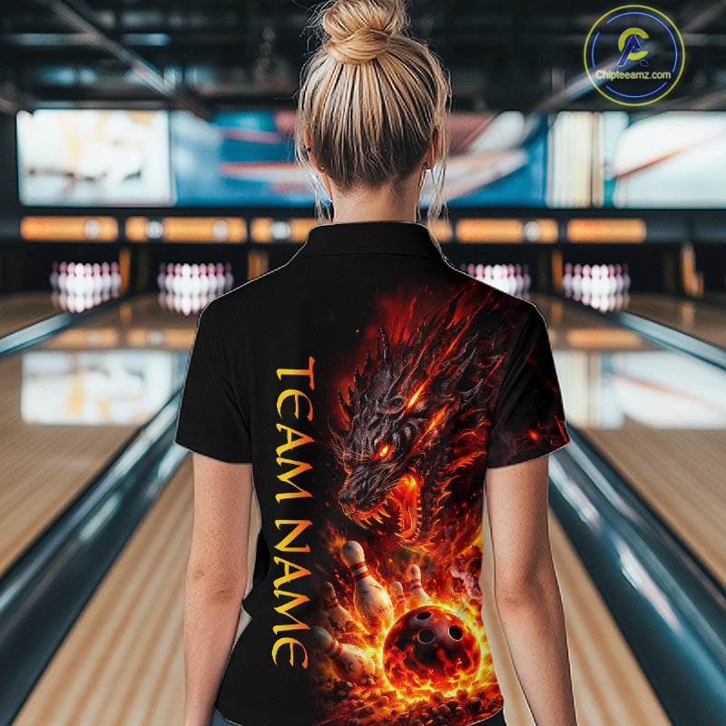 Person wearing a black t-shirt with a dragon design and 'Team Name' text in a bowling alley.