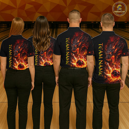 Four people wearing black shirts with a dragon design on the back, standing in a bowling alley.