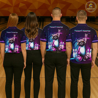 Four people standing with their backs to the camera in a bowling alley, wearing matching dark purple short-sleeve bowling shirts with a raccoon and bowling pins graphic on the back, paired with black pants.