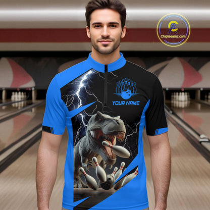 A man wearing a short-sleeve quarter-zip bowling jersey with a blue and black graphic design featuring a T-rex, lightning, bowling pins, and the text 'YOUR NAME' 
