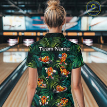 Load image into Gallery viewer, Person wearing a tropical-themed shirt with cartoon characters in a bowling alley.