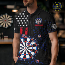 Load image into Gallery viewer, Male model wearing a custom black darts polo shirt featuring an American flag star pattern, a large dartboard graphic, and customizable 'YOUR NAME' text on the chest