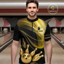 Load image into Gallery viewer, Man wearing a black and gold bowling jersey with a bowling alley in the background