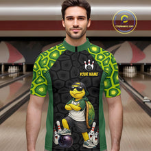Load image into Gallery viewer, A man wearing custom green turtle bowling quarter-zip shirt front view featuring a cool cartoon mascot and bowling ball, displaying Your Name, at the bowling alley
