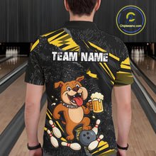 Load image into Gallery viewer, A man wearing custom black yellow bulldog bowling polo shirt back view featuring a bowling ball, beer mug and yellow paint splash pattern, displaying Team Name, at the bowling alley
