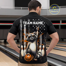 Load image into Gallery viewer, Person wearing a black shirt with a raccoon graphic and 'TEAM NAME' text in a bowling alley.