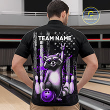 Load image into Gallery viewer, Person wearing a black shirt with a raccoon graphic and 'TEAM NAME' text in a bowling alley.