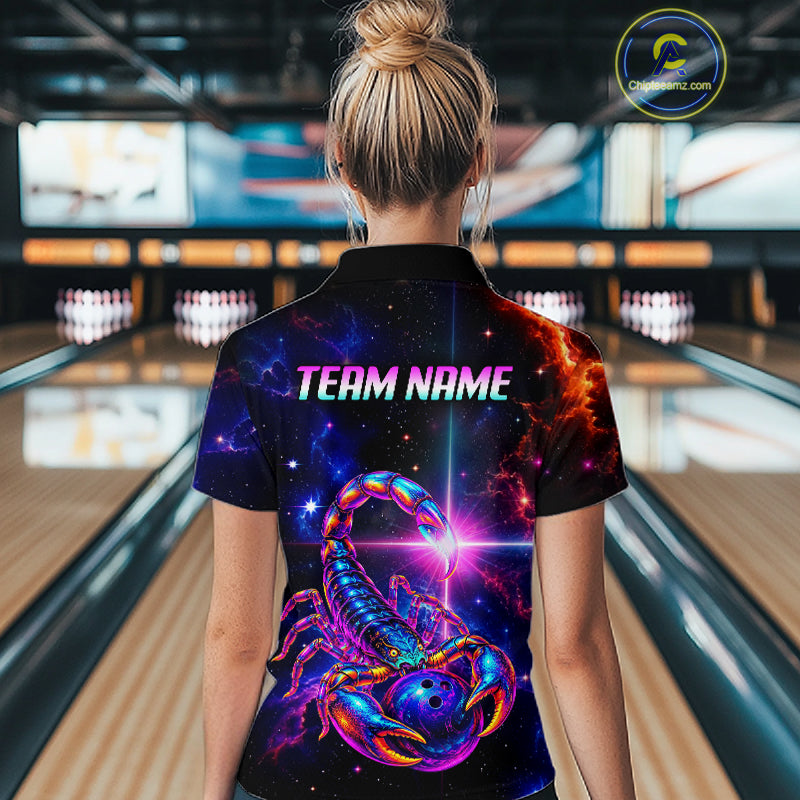 A woman viewed from behind wearing a short-sleeve collared bowling shirt with a vivid cosmic scorpion graphic and the text 'TEAM NAME' on the back. Bowling lanes and pins are visible in the blurred background