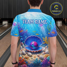 Load image into Gallery viewer, Person wearing a colorful bowling shirt with an underwater design and 'TEAM NAME' text on a bowling alley.