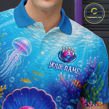 Load image into Gallery viewer, Blue polo shirt with underwater design and 'Your Name' text, brand logo visible.