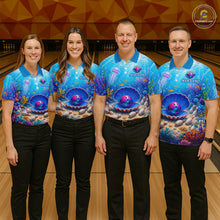 Load image into Gallery viewer, Four people wearing matching blue bowling shirts with a colorful design in a bowling alley.