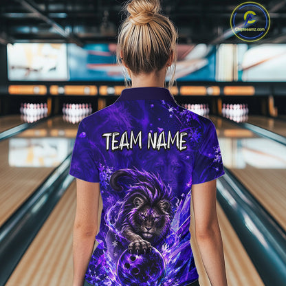 A woman viewed from behind wearing a purple bowling-themed short-sleeve shirt with a large lion graphic and the text 'TEAM NAME' on the back, standing in a bowling alley.