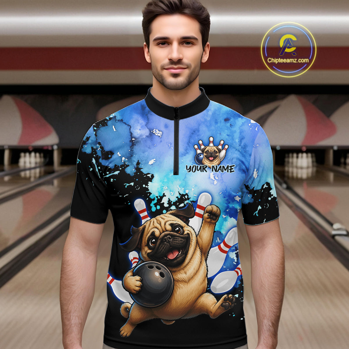 A man wearing a short-sleeve bowling-themed quarter-zip shirt with a cartoon pug bowling graphic, set against a blurred bowling alley background. 