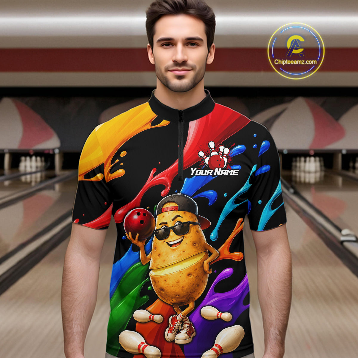 Man wearing a colorful bowling-themed shirt with a potato character in a bowling alley.