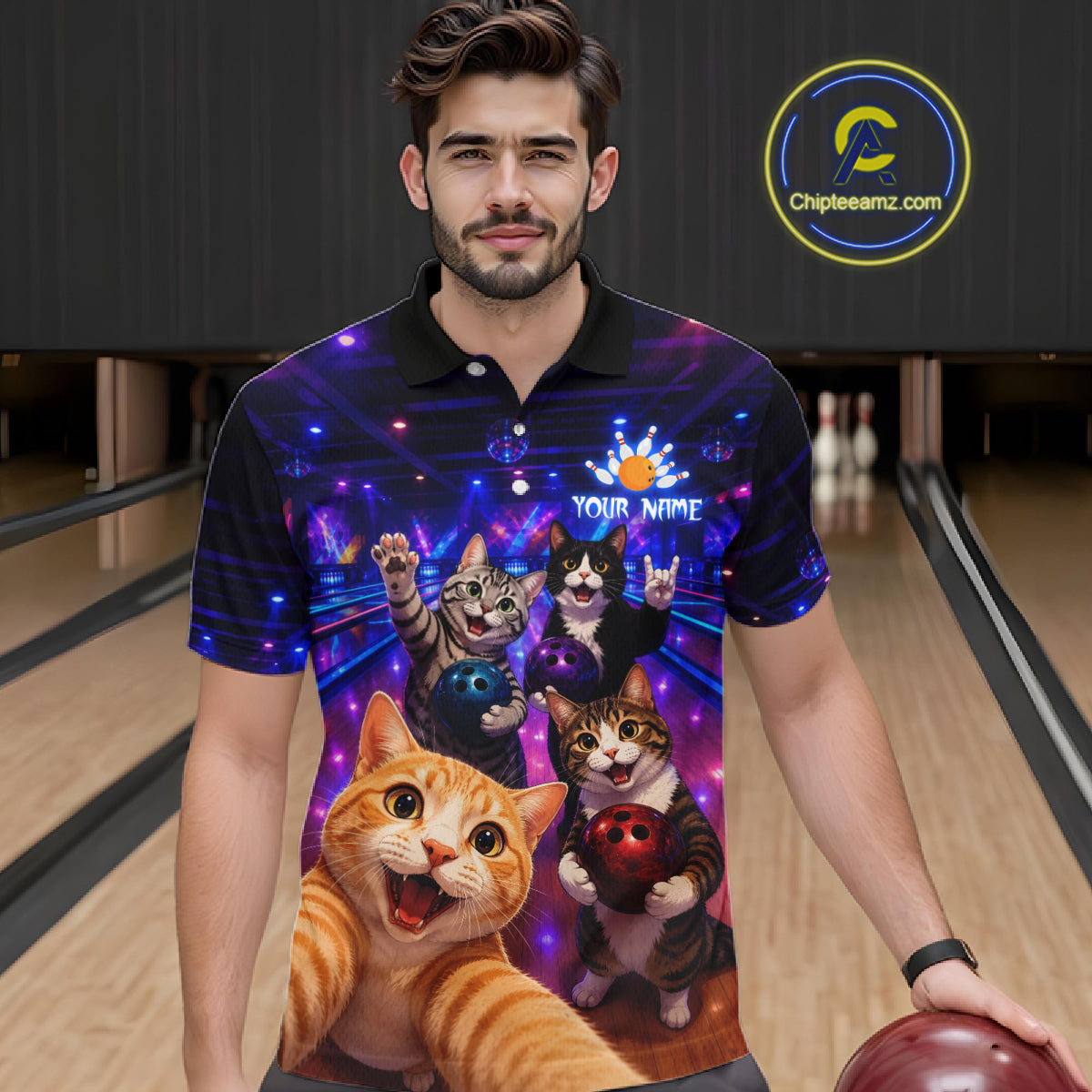 Man wearing a colorful polo shirt with cartoon cats and bowling elements in a bowling alley.