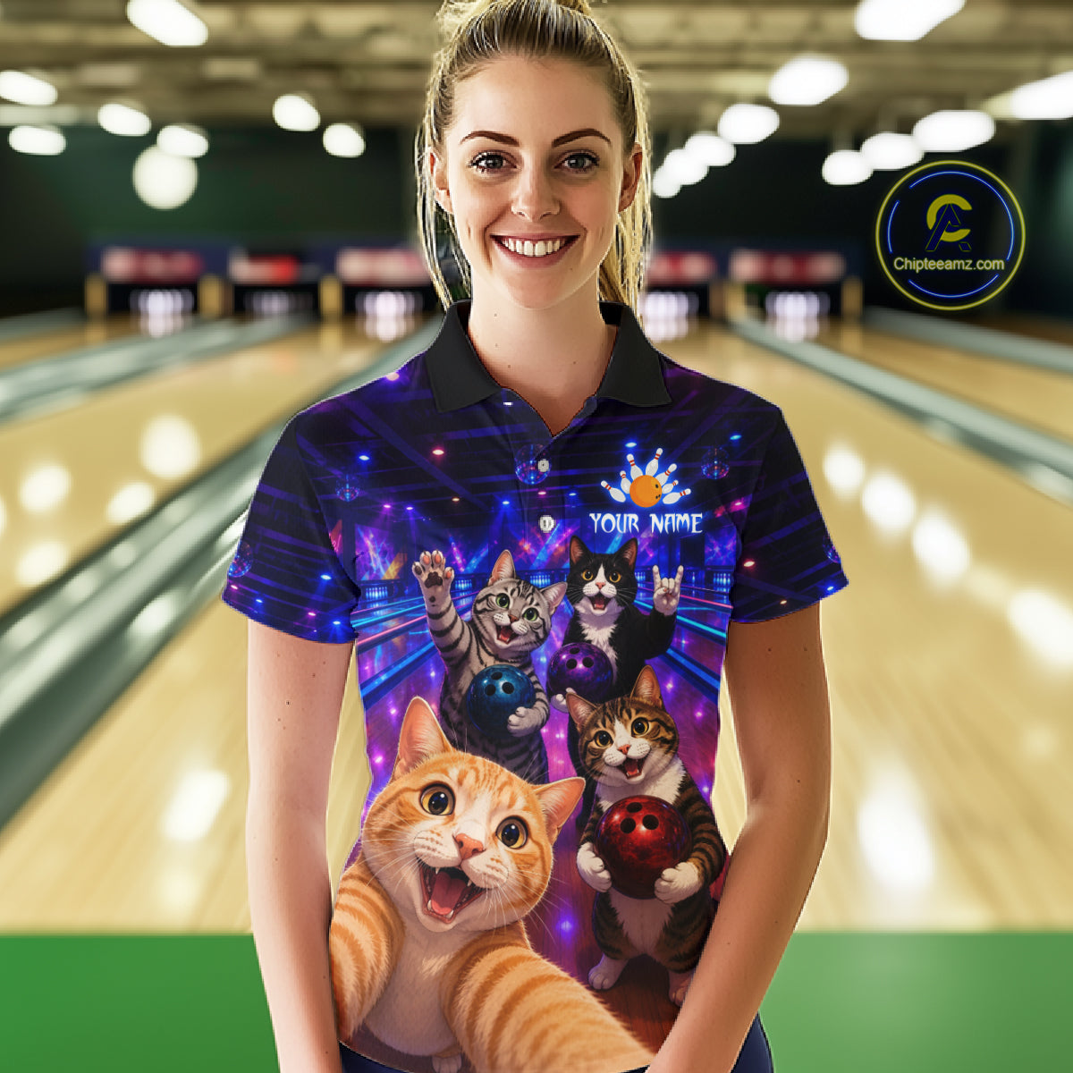 Person wearing a colorful polo shirt with cat designs in a bowling alley.