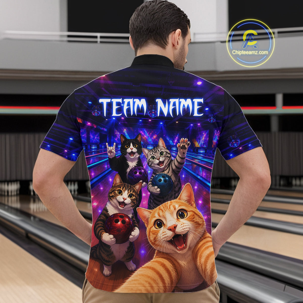 Person wearing a shirt with cartoon cats and 'Team Name' text in a bowling alley.