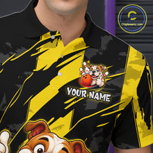 Load image into Gallery viewer, Close-up front view of a custom black yellow bulldog bowling polo shirt showing the personalized player name, playful cartoon bulldog graphic and yellow black paint stroke design